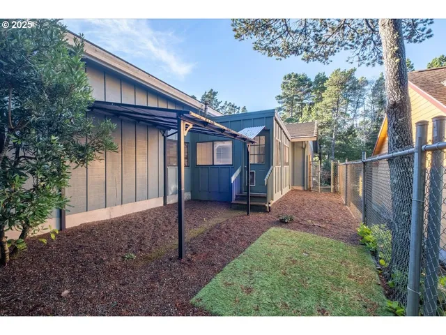 a view of balcony with wooden floor and fence