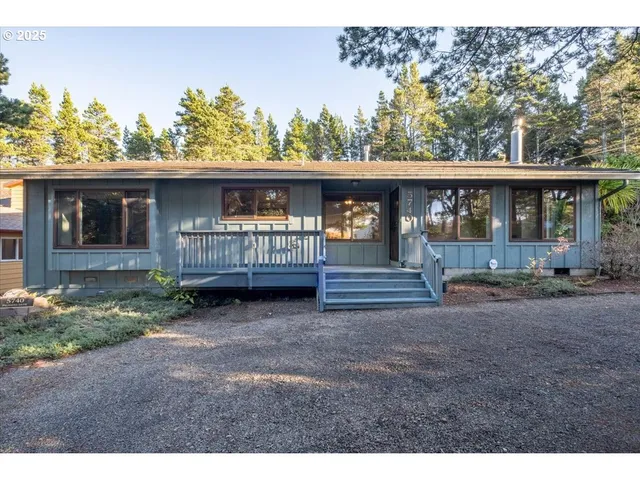 a view of a house with a yard and sitting area