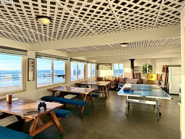 a view of a house with backyard sitting area and garden