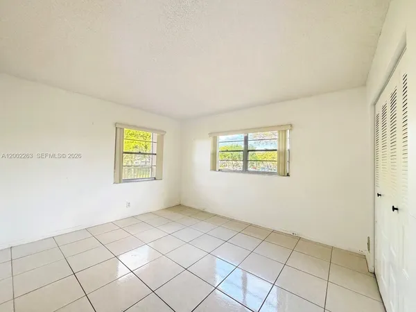 a view of an empty room and window