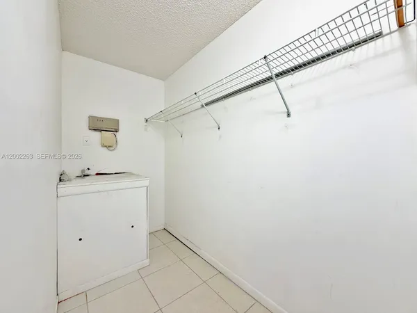 a utility room with a sink dryer and washer