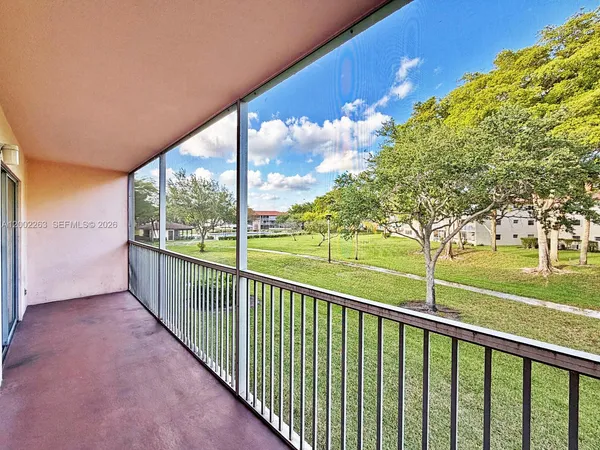 a view of balcony with yard