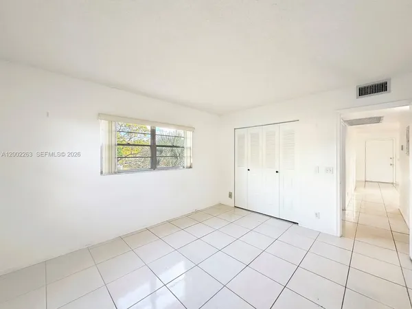 a view of an empty room and window