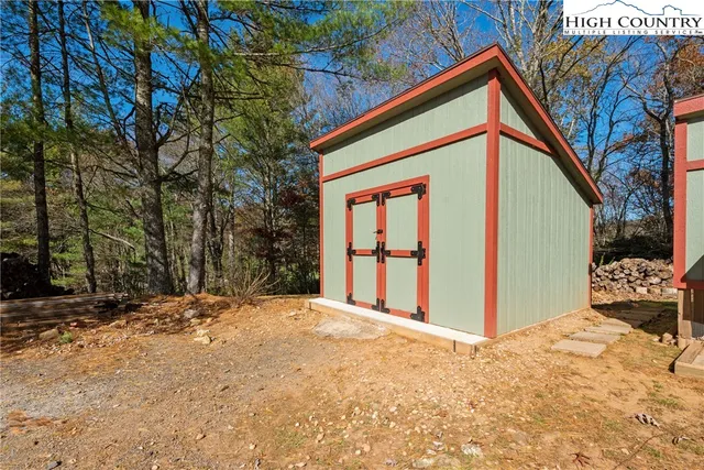 a kitchen with a refrigerator a sink and cabinets