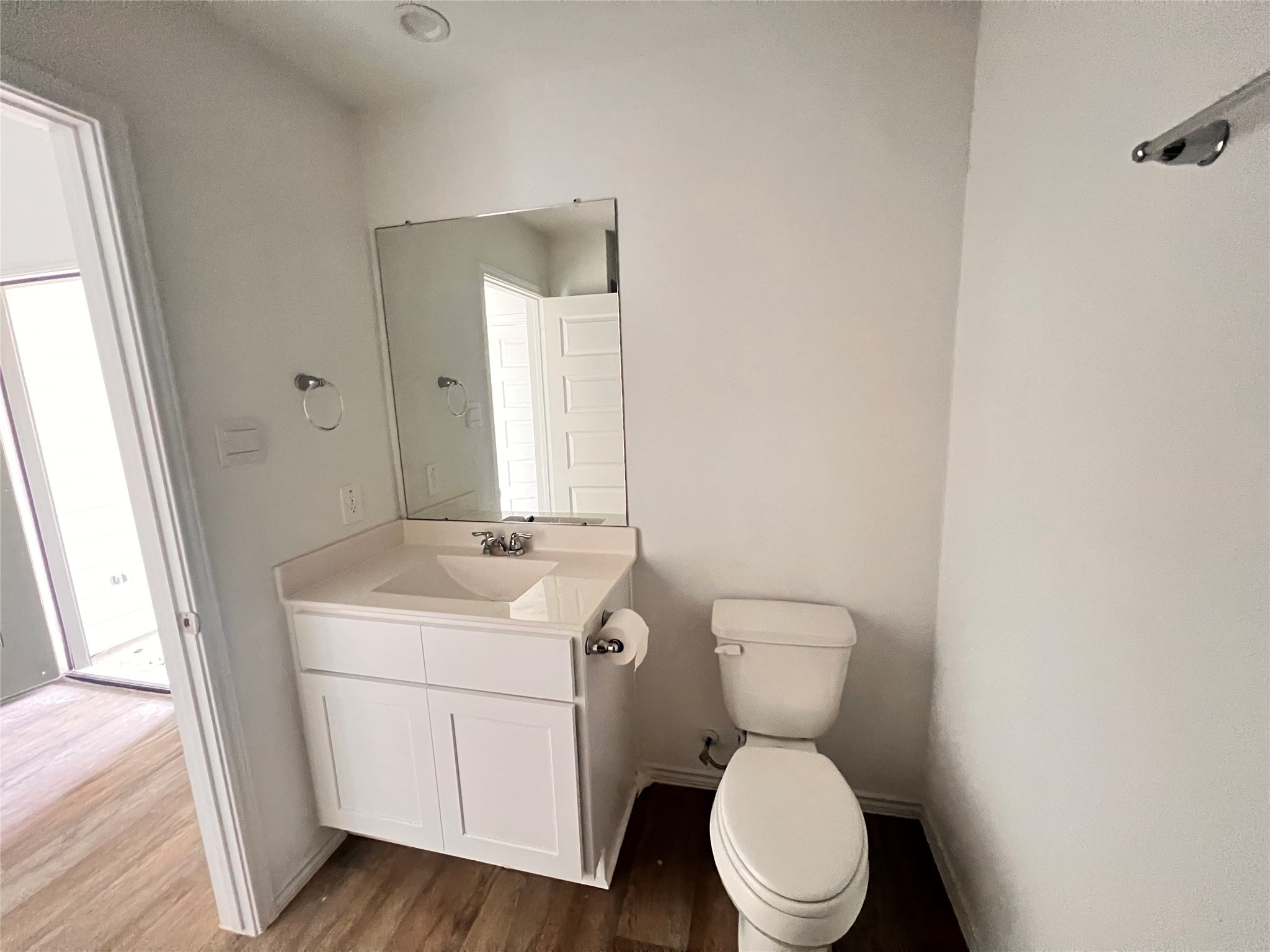 3826 Lanercost Lane Fulshear, TX 77441 - Photo 14 of 29 a bathroom with a toilet a sink and mirror