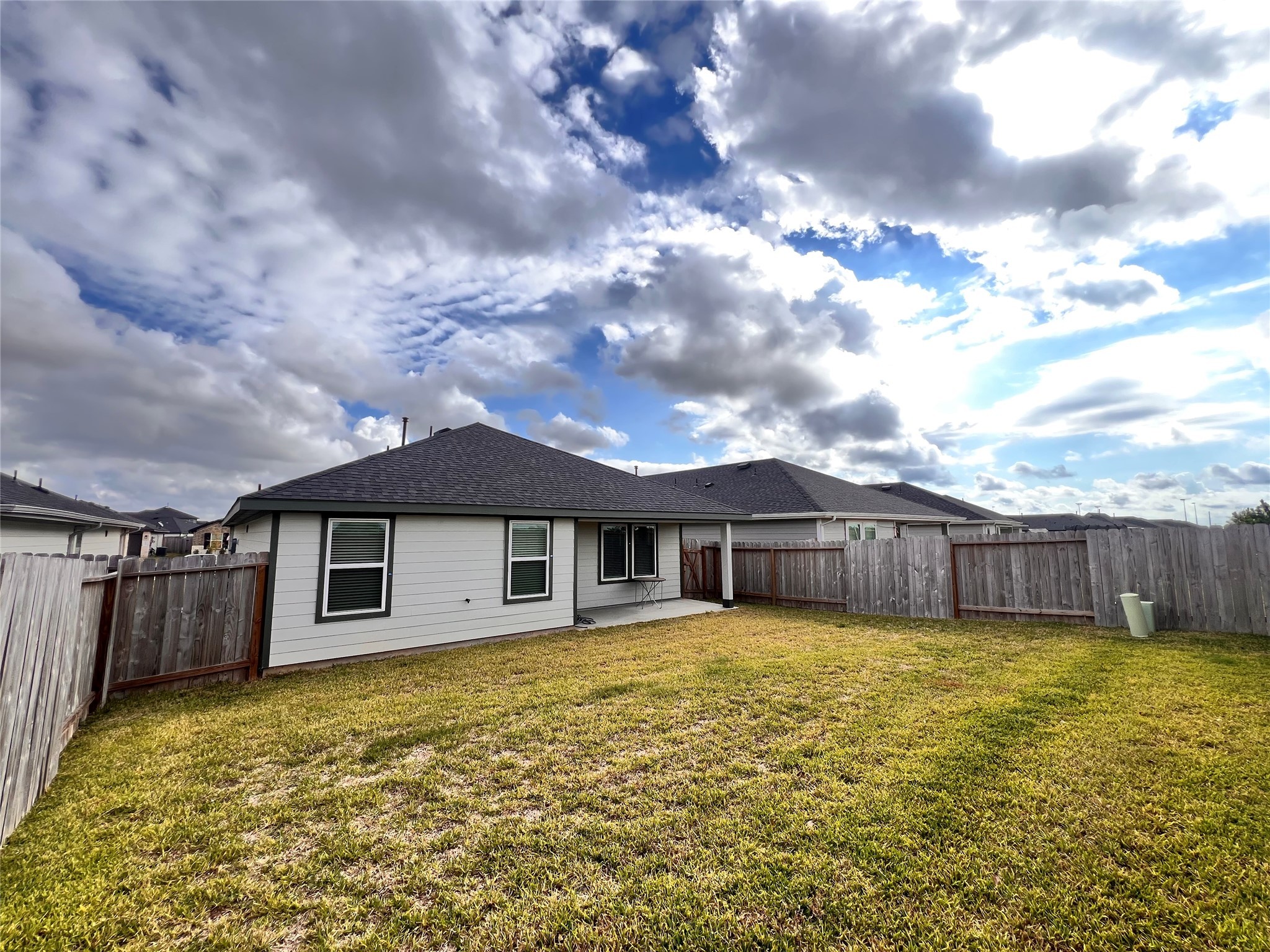 3826 Lanercost Lane Fulshear, TX 77441 - Photo 24 of 29 a view of a house with a swimming pool and a yard
