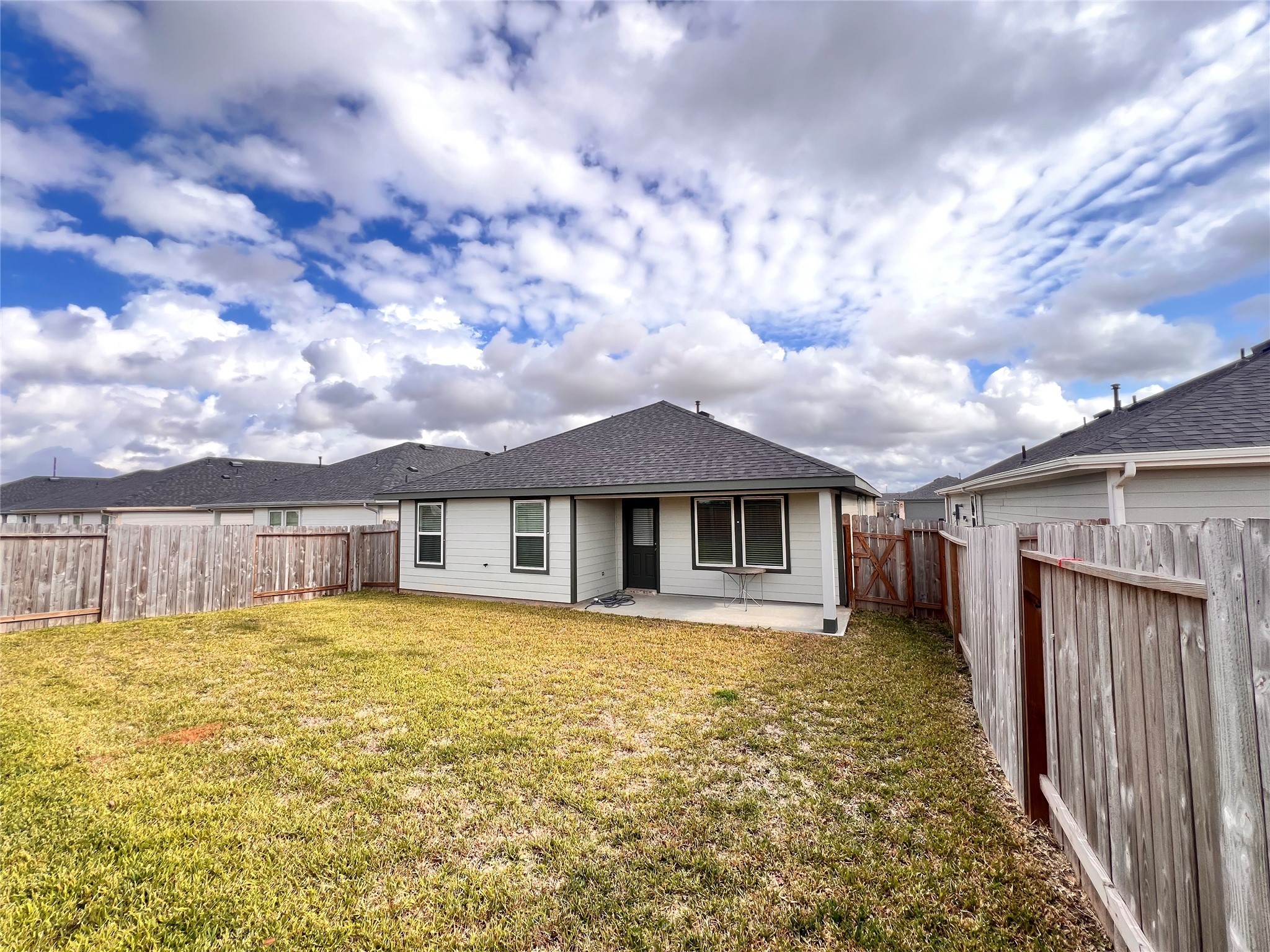 3826 Lanercost Lane Fulshear, TX 77441 - Photo 25 of 29 a view of a house with a tub and wooden fence
