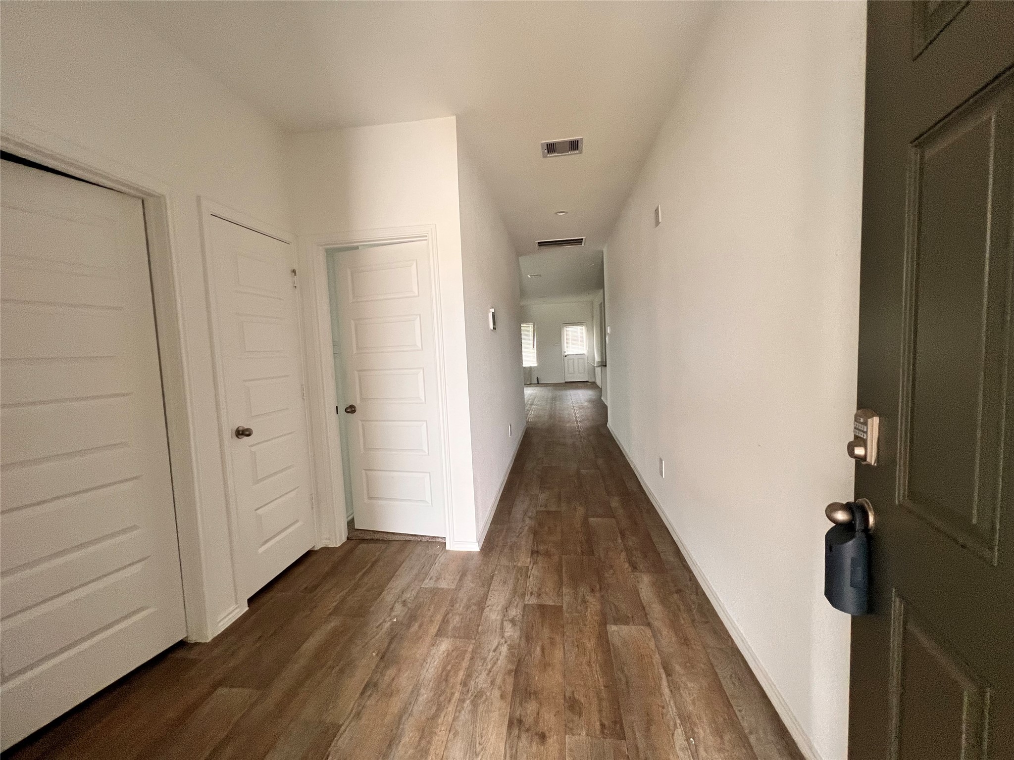 3826 Lanercost Lane Fulshear, TX 77441 - Photo 5 of 29 a view of a hallway with wooden floor and staircase