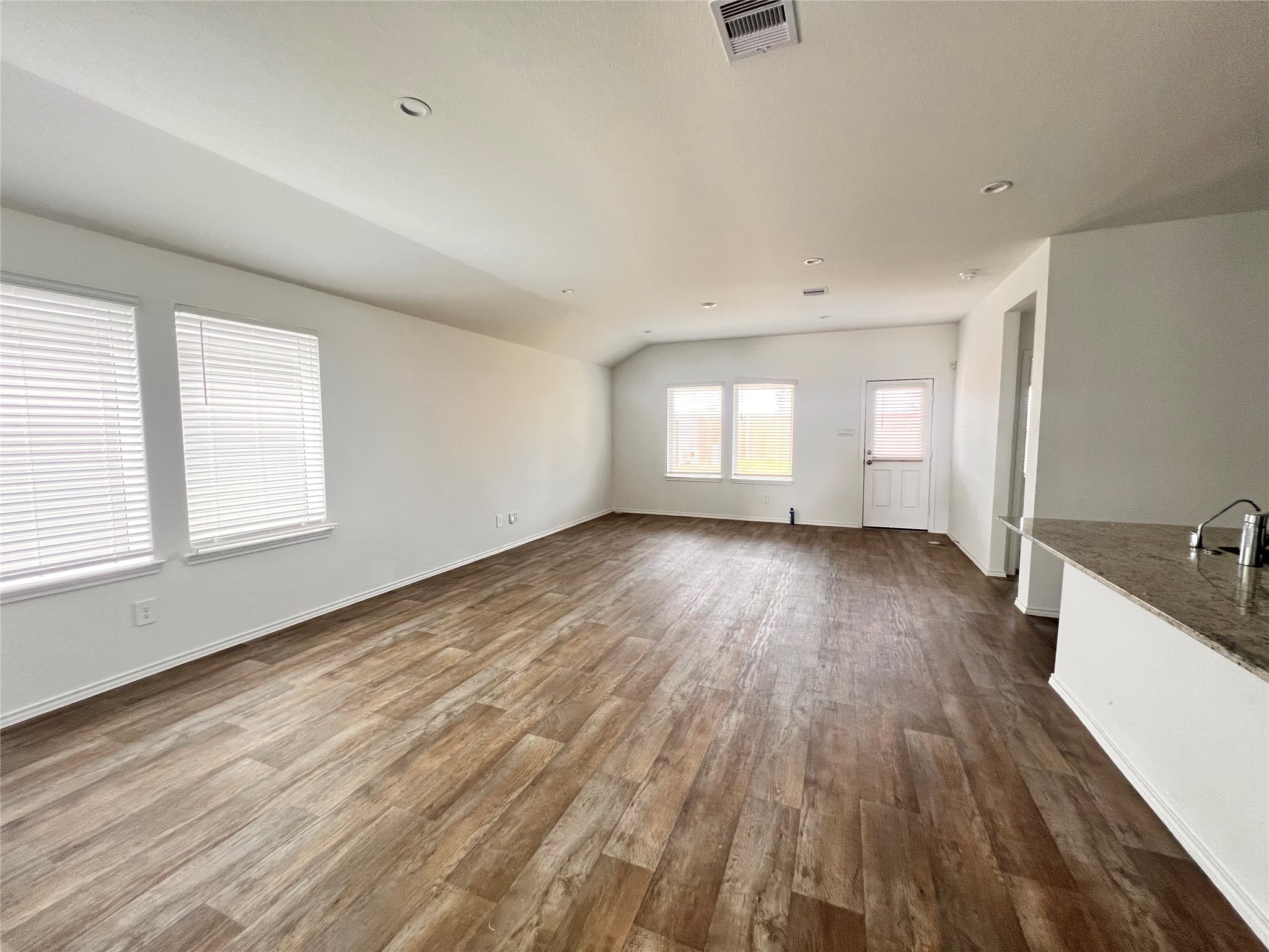 3826 Lanercost Lane Fulshear, TX 77441 - Photo 8 of 29 an empty room with wooden floor and windows