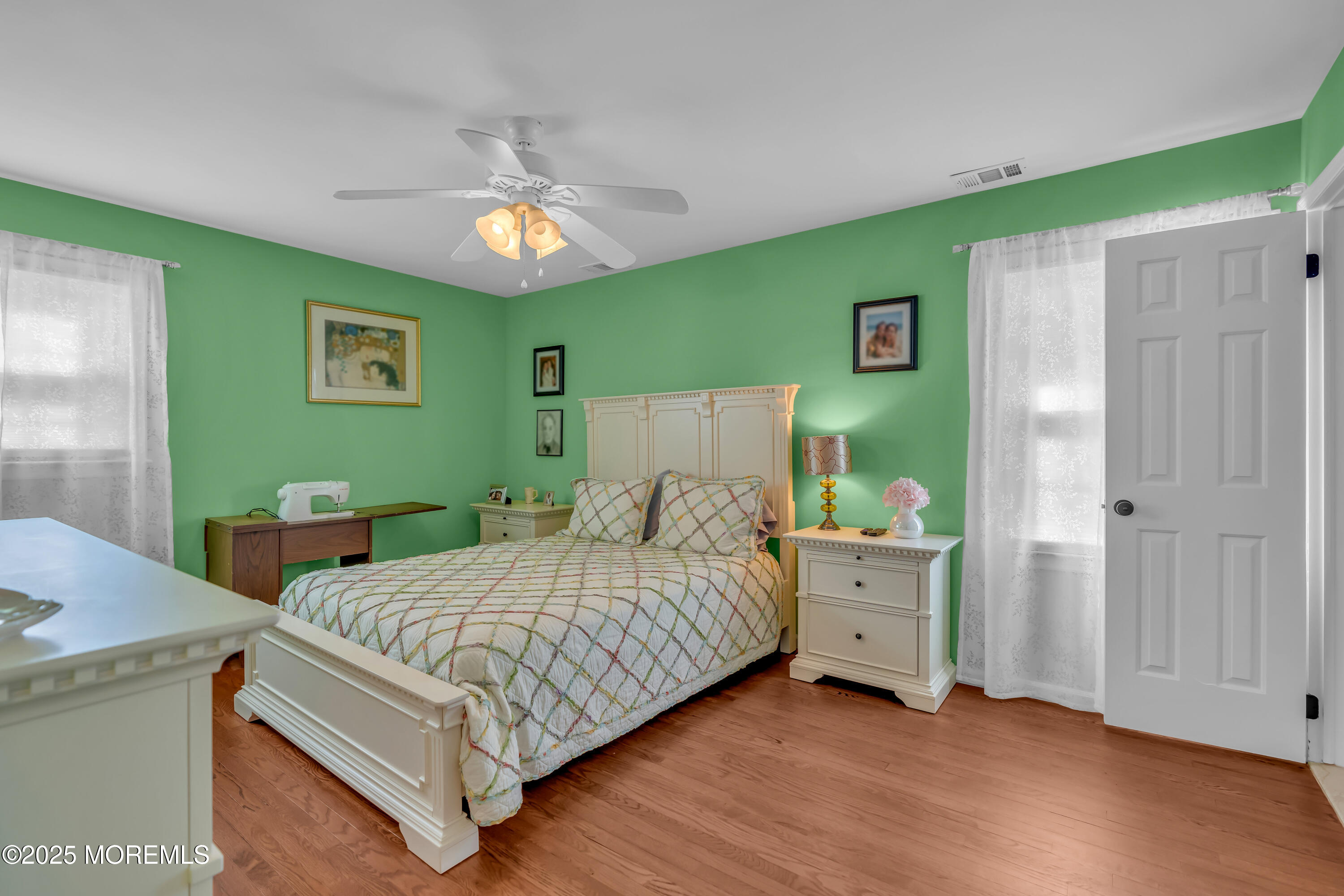 1417 Silverton Road Toms River, NJ 08755 - Photo 24 of 41 a bedroom with a bed and a chandelier