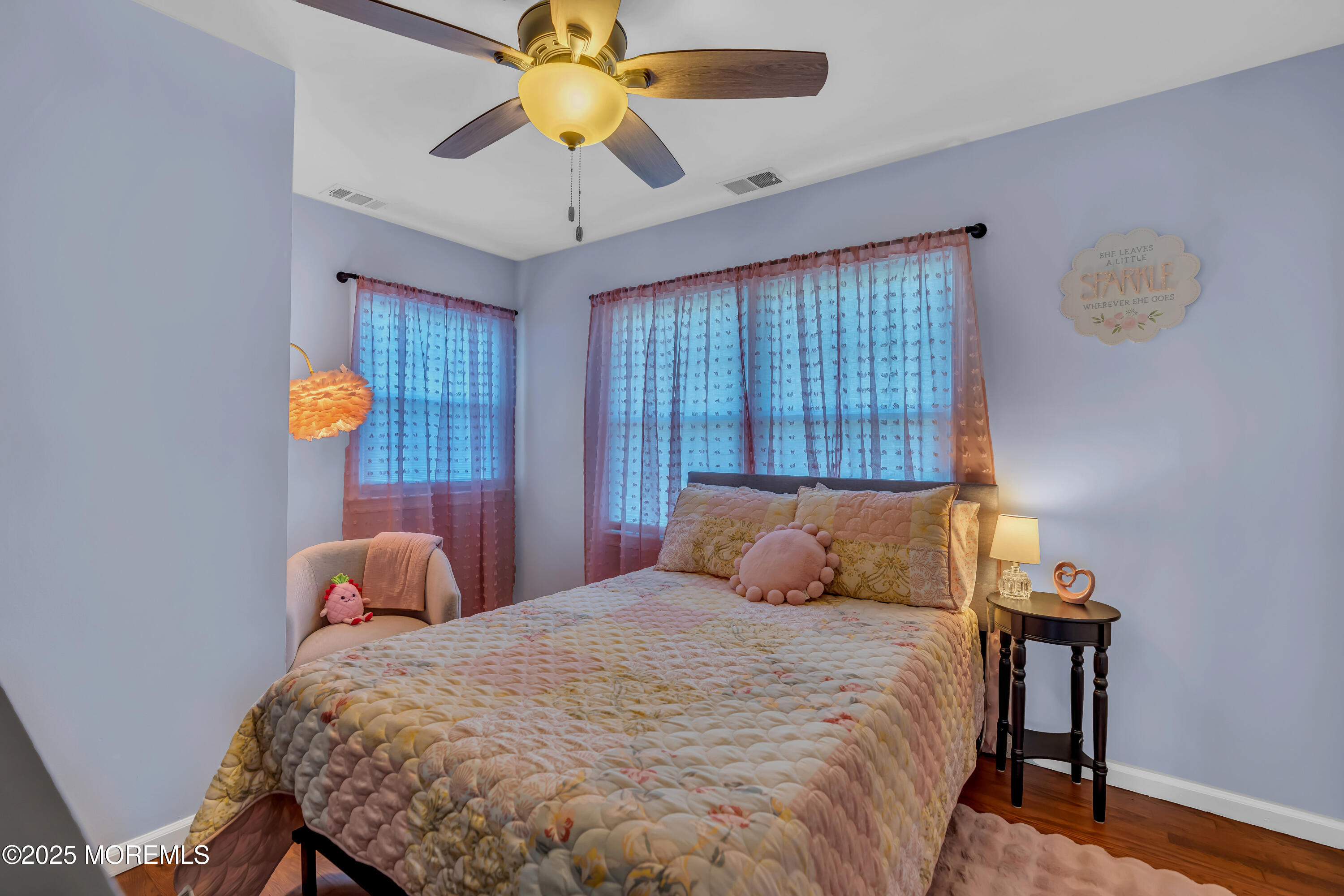 1417 Silverton Road Toms River, NJ 08755 - Photo 25 of 41 a bedroom with a bed and a chandelier