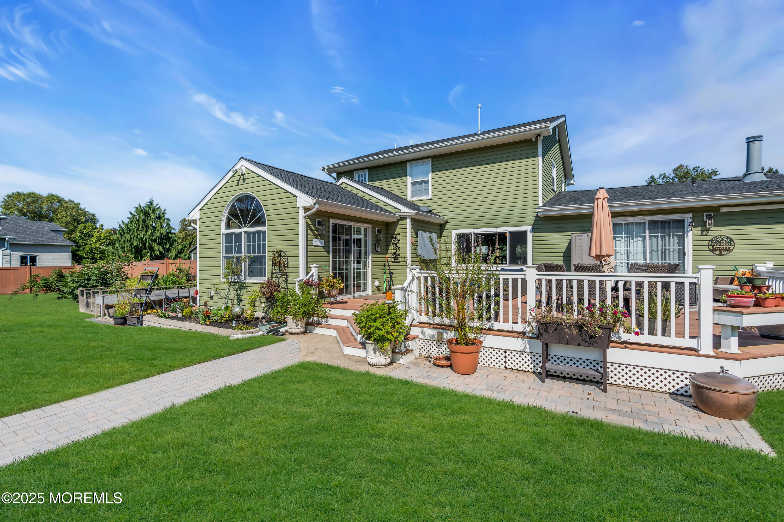 1417 Silverton Road Toms River, NJ 08755 - Photo 28 of 41 a front view of a house with a garden and porch