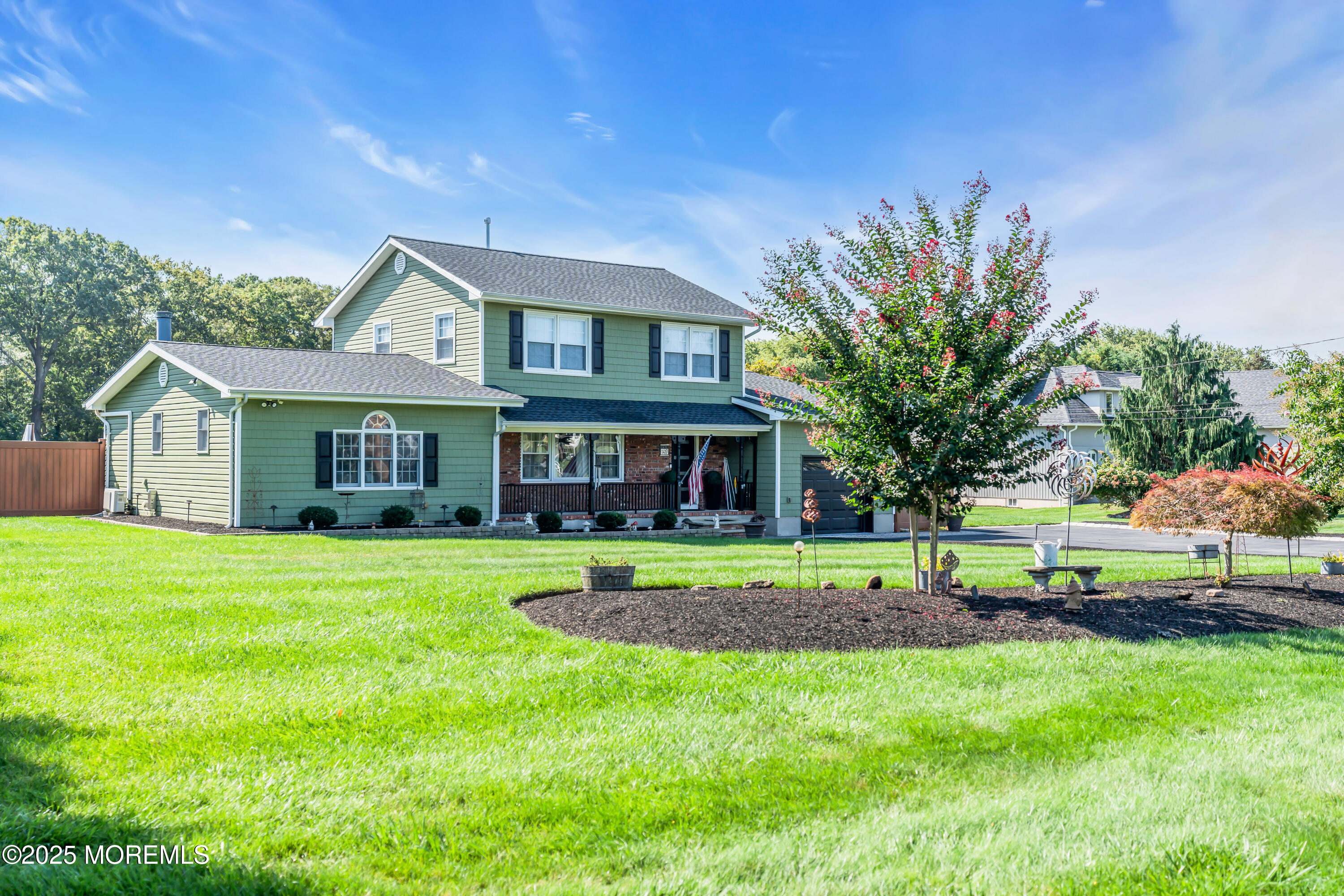 1417 Silverton Road Toms River, NJ 08755 - Photo 3 of 41 a front view of a house with a yard and trees