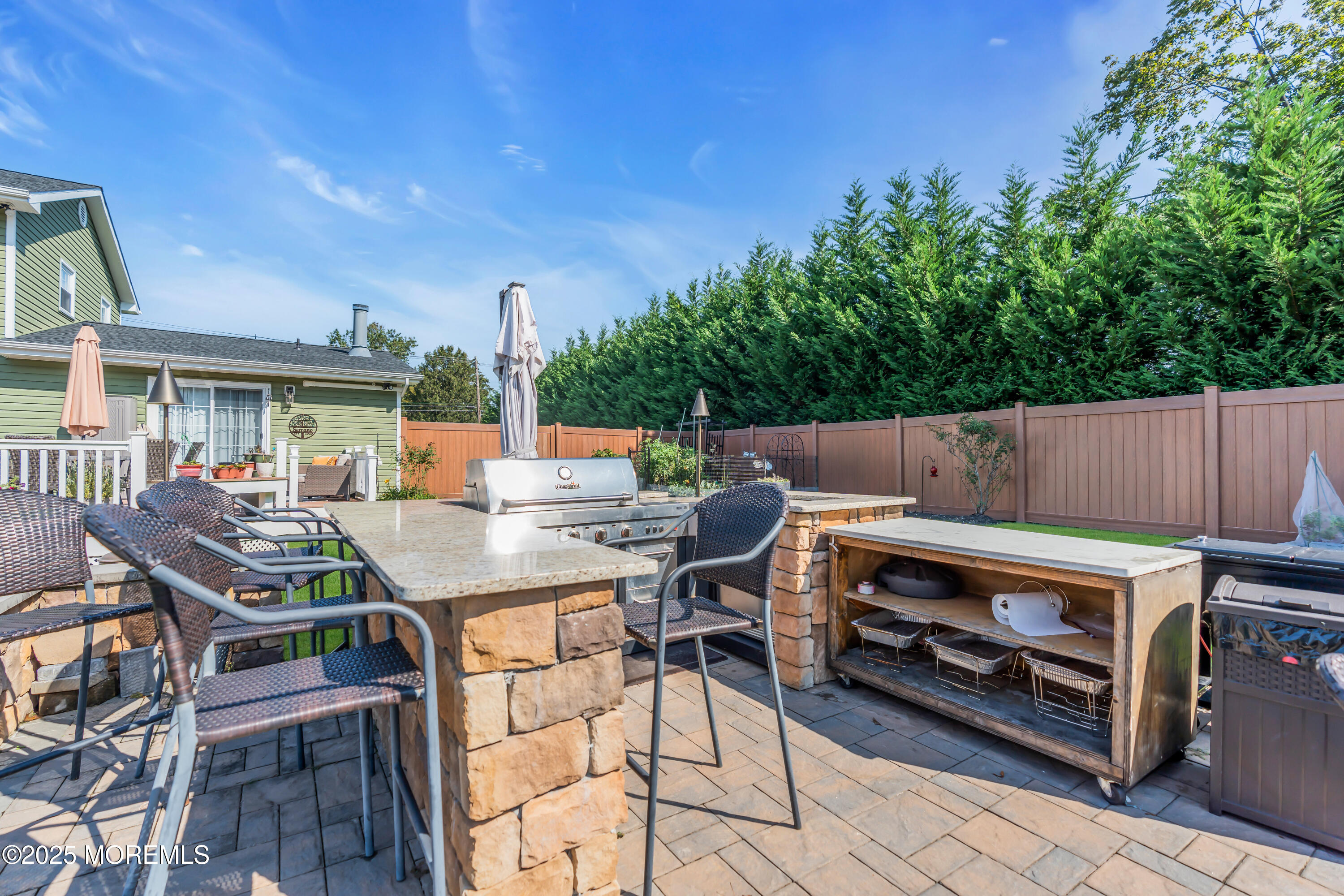 1417 Silverton Road Toms River, NJ 08755 - Photo 32 of 41 a view of a patio with table and chairs and potted plants