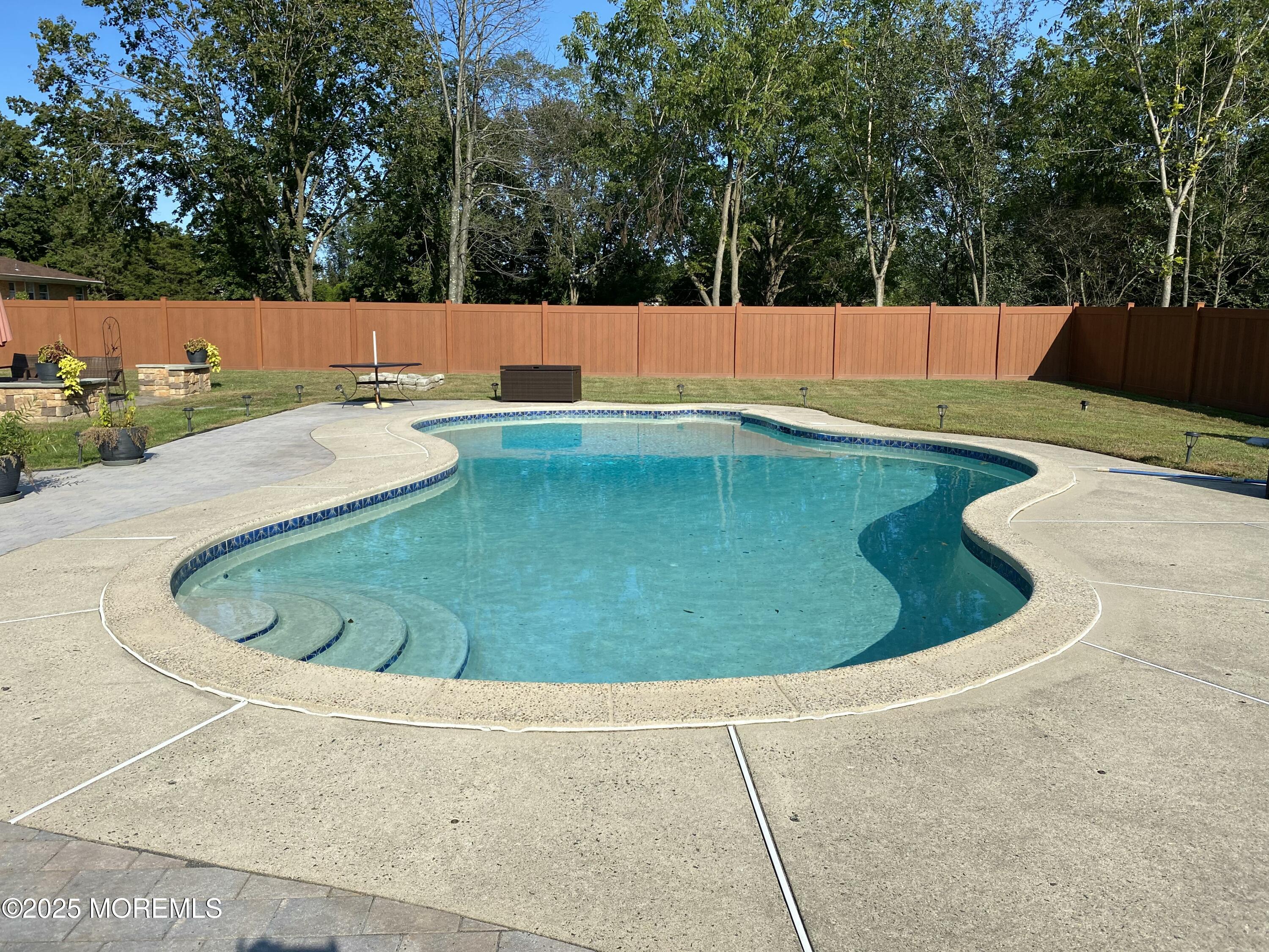 1417 Silverton Road Toms River, NJ 08755 - Photo 34 of 41 a view of a swimming pool with a yard