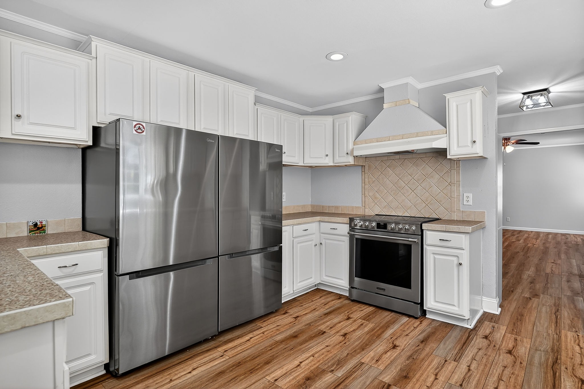 16130 Buffalo Valley Road Silver Point, TN 38582 - Photo 27 of 47 a kitchen with stainless steel appliances a refrigerator sink and cabinets