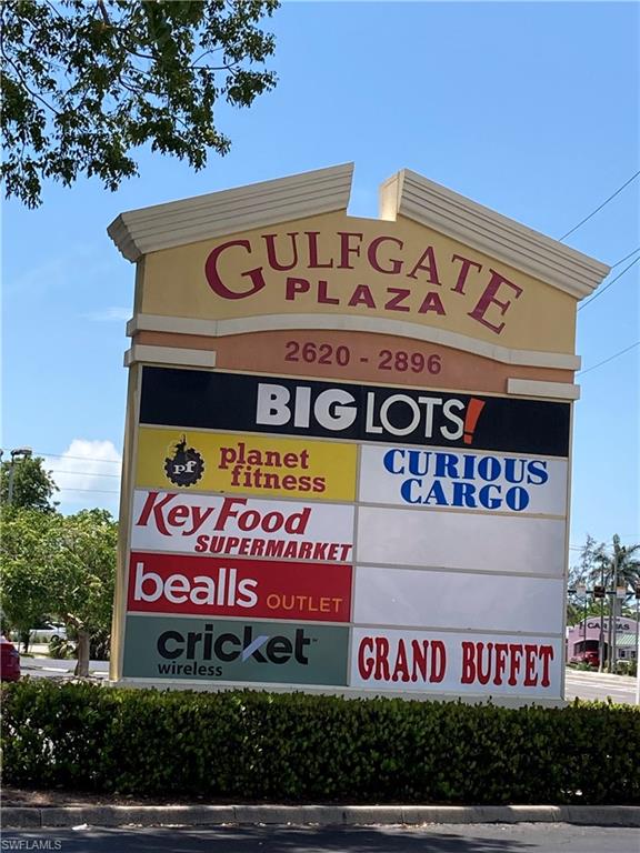 125 Lee Street Naples, FL 34112 - Photo 6 of 10 a sign that is on a pole