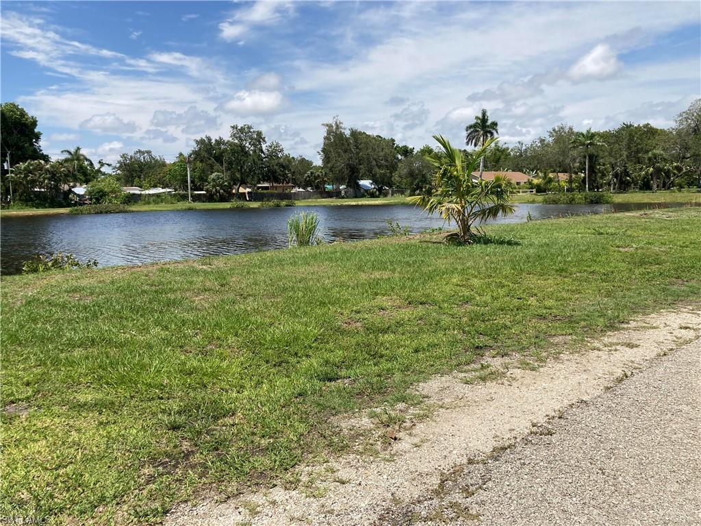 125 Lee Street Naples, FL 34112 - Photo 7 of 10 a view of a lake with houses
