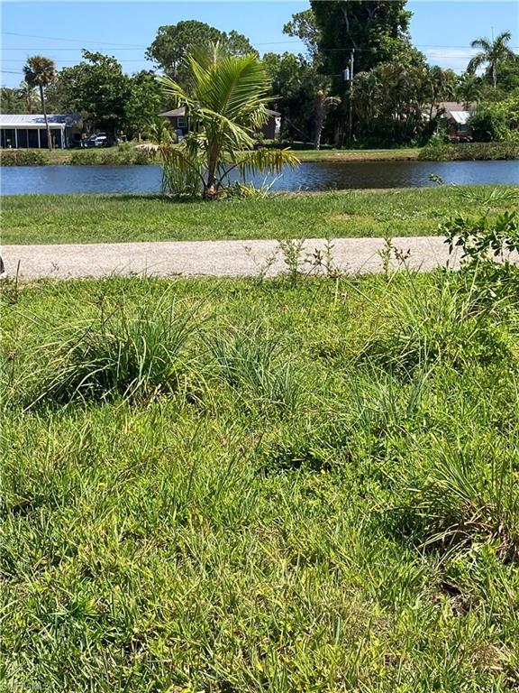 125 Lee Street Naples, FL 34112 - Photo 8 of 10 a view of a golf course with a lake
