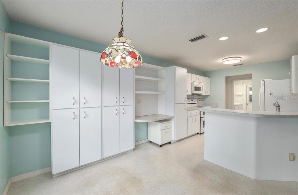 5393 Southwest 109th Place Road Ocala, FL 34476 - Photo 14 of 54 a view of a kitchen with cabinet and a chandelier
