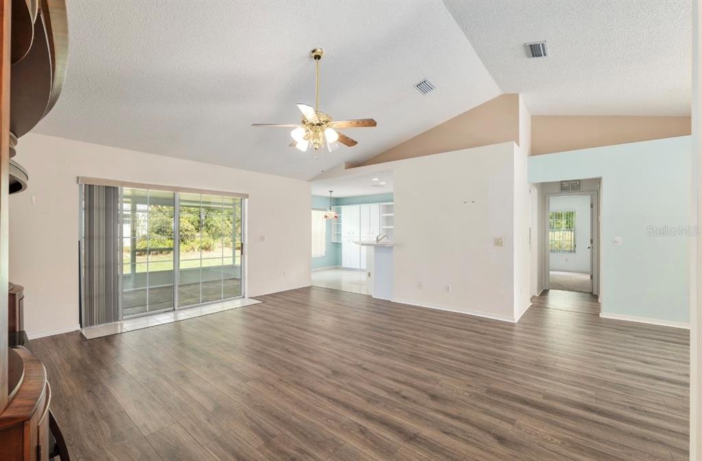 5393 Southwest 109th Place Road Ocala, FL 34476 - Photo 19 of 54 wooden floor in an empty room with a window