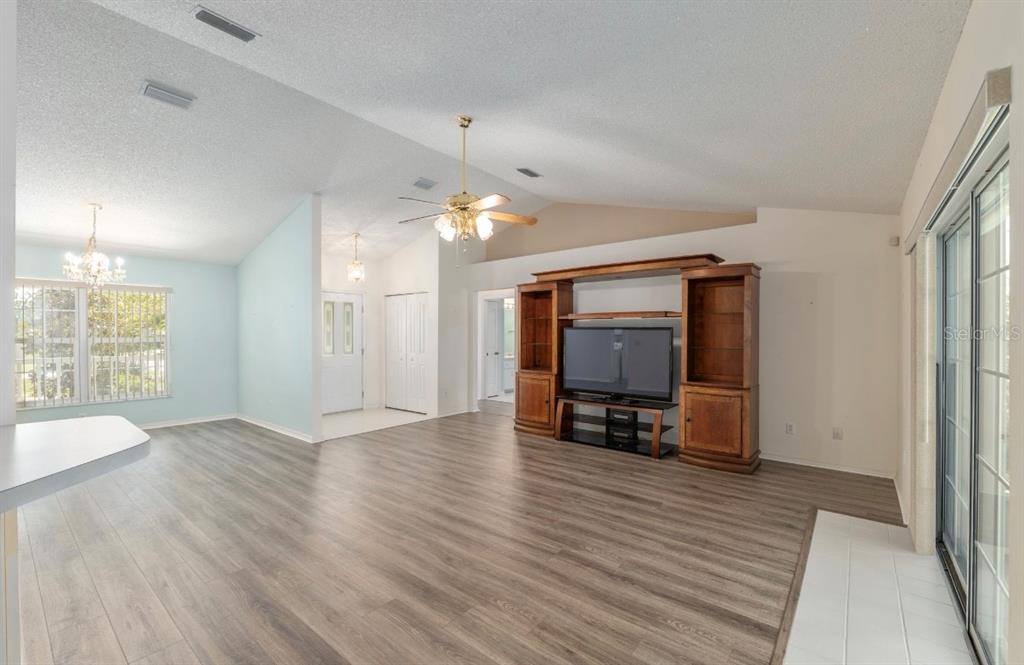 5393 Southwest 109th Place Road Ocala, FL 34476 - Photo 20 of 54 a view of livingroom with furniture flat screen tv and wooden floor