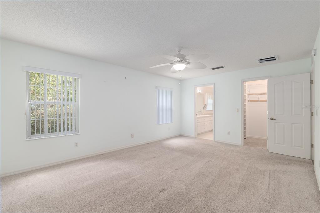 5393 Southwest 109th Place Road Ocala, FL 34476 - Photo 21 of 54 an empty room with windows and closet