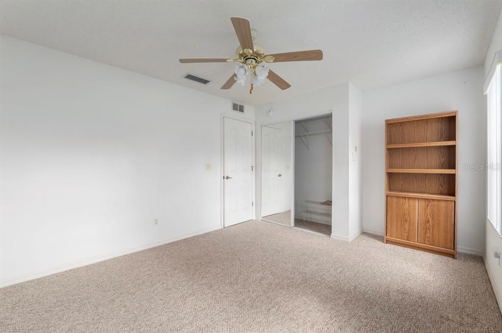 5393 Southwest 109th Place Road Ocala, FL 34476 - Photo 32 of 54 a view of an empty room and a ceiling fan
