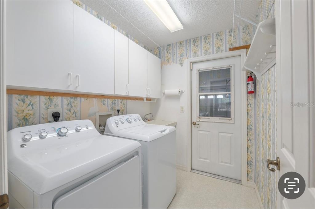 5393 Southwest 109th Place Road Ocala, FL 34476 - Photo 33 of 54 a utility room with dryer and washer