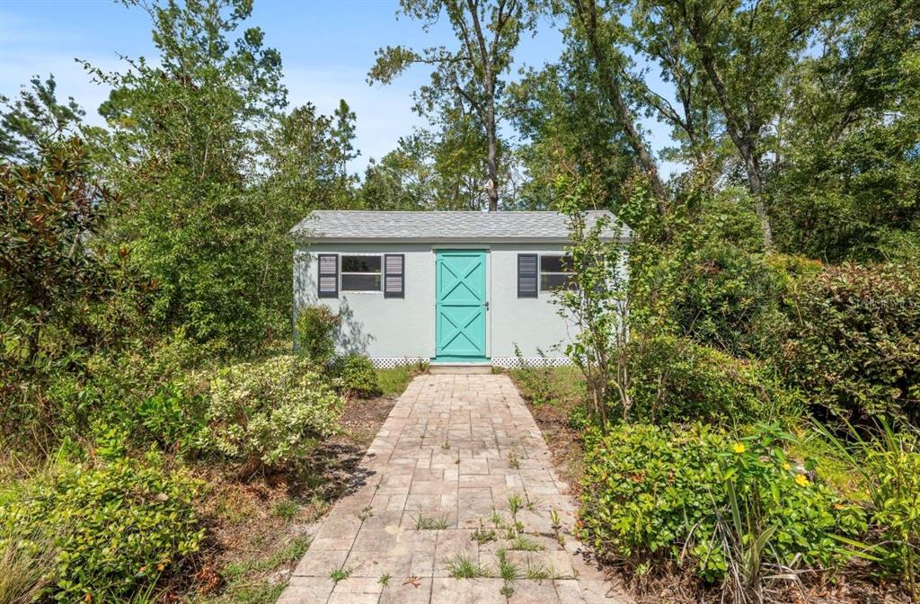 5393 Southwest 109th Place Road Ocala, FL 34476 - Photo 39 of 54 a view of a yard with plants and large trees