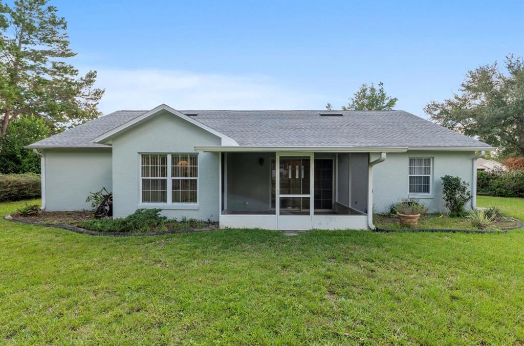 5393 Southwest 109th Place Road Ocala, FL 34476 - Photo 44 of 54 a front view of a house with a yard and porch