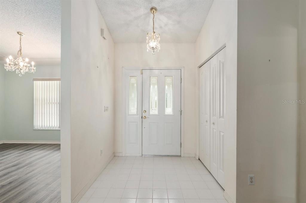 5393 Southwest 109th Place Road Ocala, FL 34476 - Photo 7 of 54 wooden floor in an empty room with a window