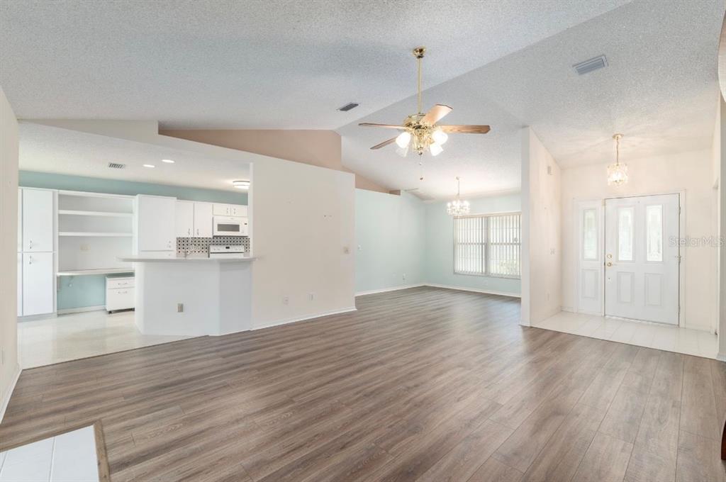 5393 Southwest 109th Place Road Ocala, FL 34476 - Photo 8 of 54 a view of empty room with wooden floor and fan