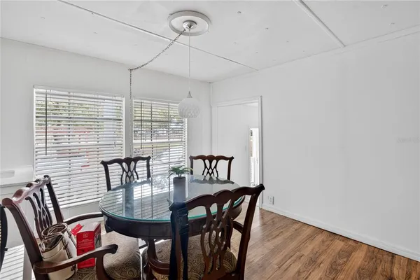 a view of a dining room with furniture window and outside view