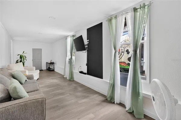 a living room with furniture and a window