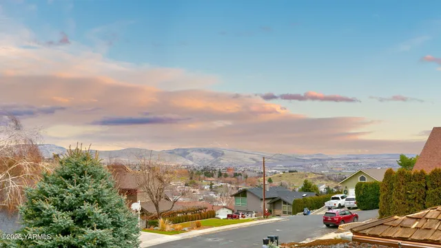 a view of a backyard with sitting area
