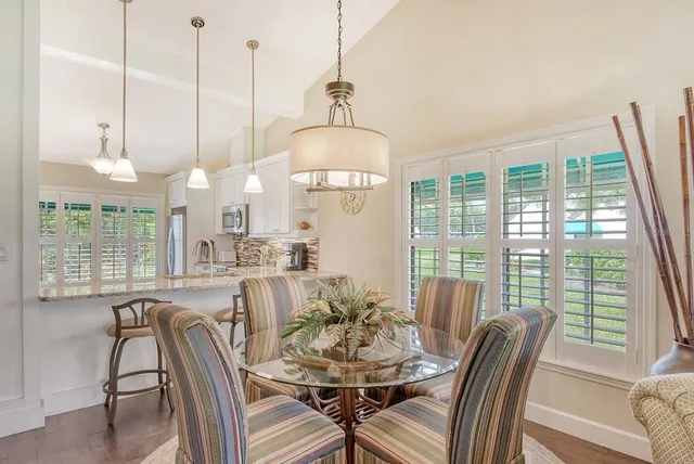 a kitchen with stainless steel appliances granite countertop a sink a stove and a microwave