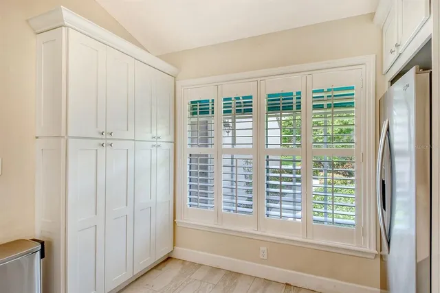 a bathroom with double vanity sinks and a mirror