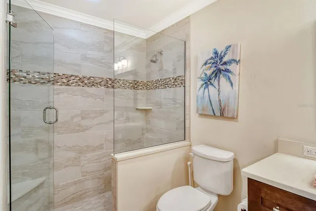 a bedroom with a bed and a desk