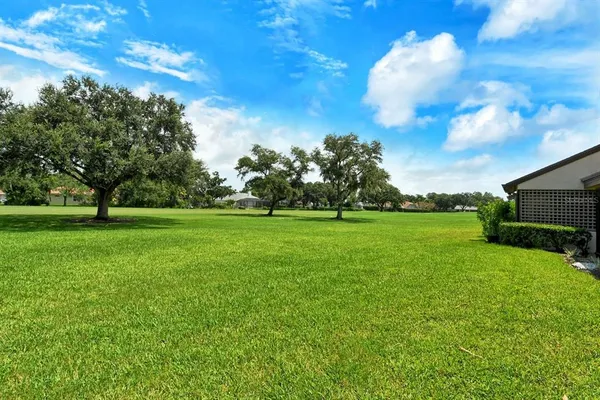 a view of a yard and front view of a house