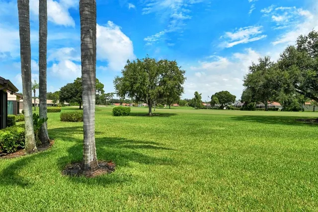 a view of a lake with houses in the back