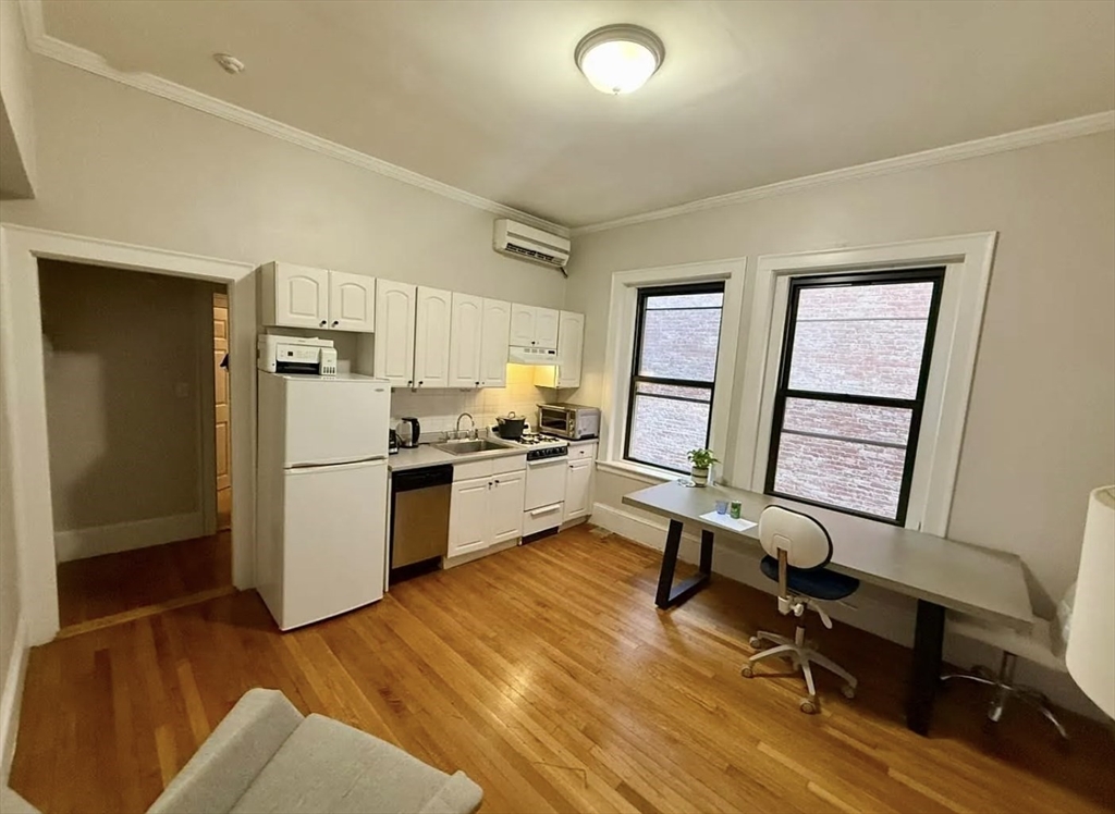 10 Fairfield Street, Unit 3 Boston, MA 02116 - Photo 2 of 8 a kitchen with a refrigerator a sink and dishwasher