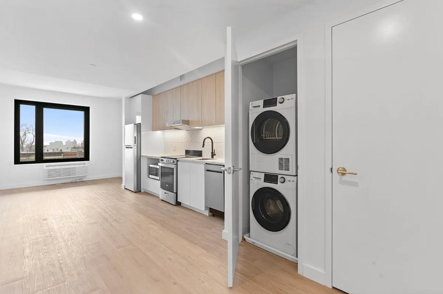 827 Sterling Place, Unit 3H Brooklyn, NY 11216 - Photo 4 of 12 a view of a kitchen with washer and dryer