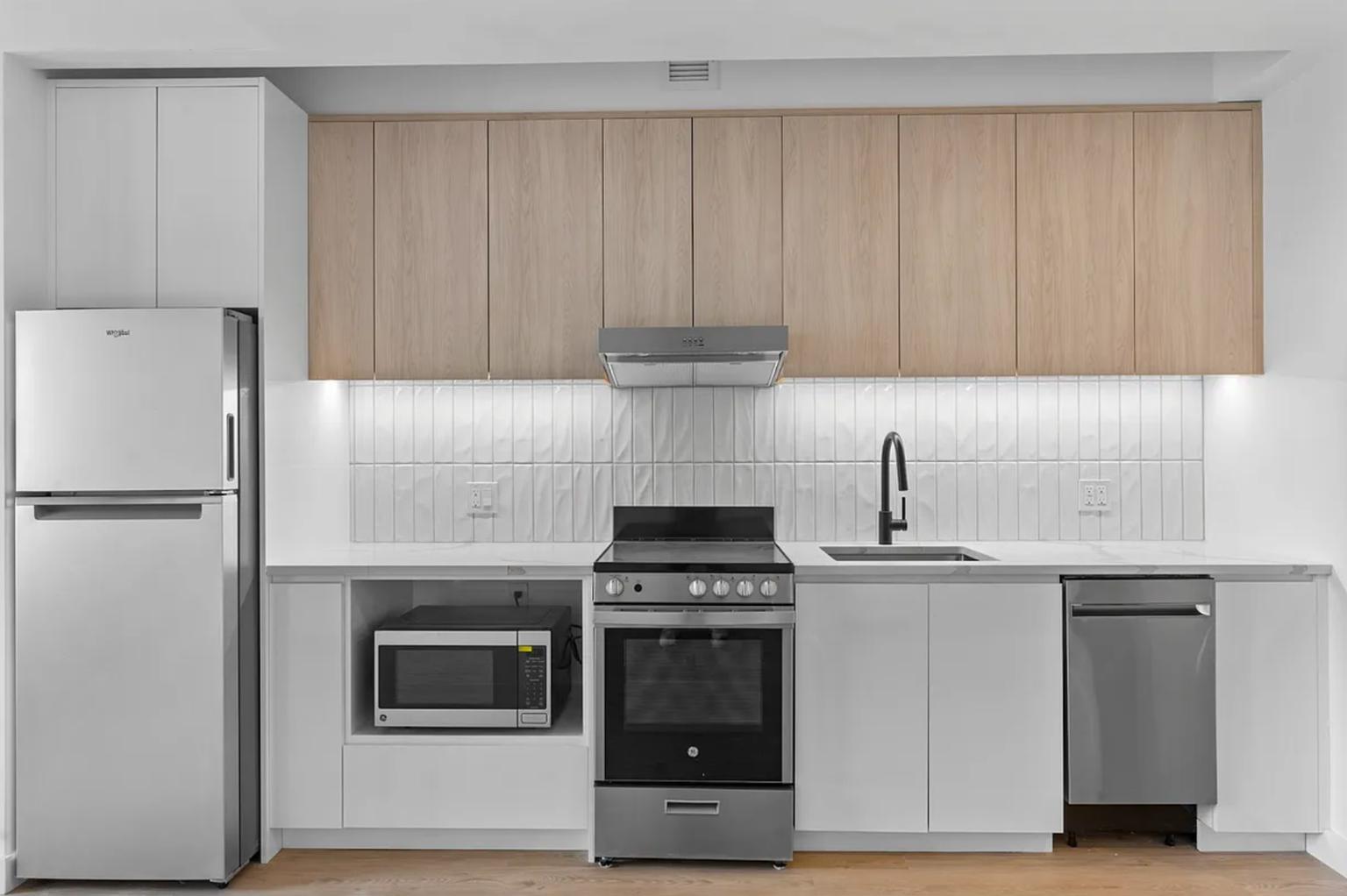 827 Sterling Place, Unit 3H Brooklyn, NY 11216 - Photo 5 of 12 a kitchen with cabinets and appliances