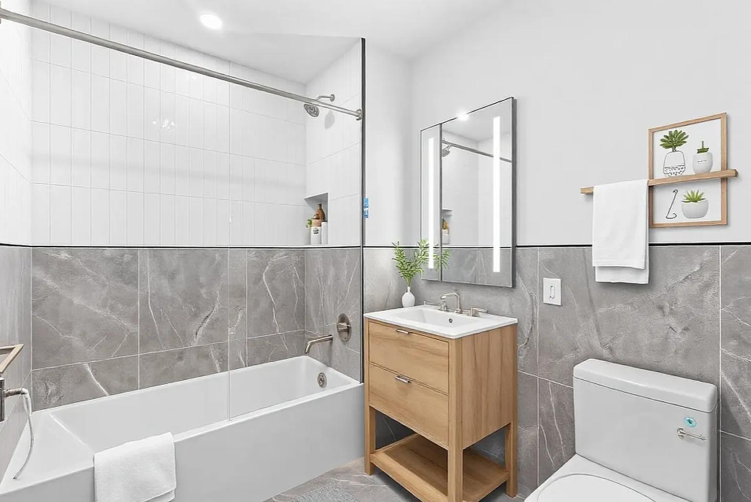 827 Sterling Place, Unit 3H Brooklyn, NY 11216 - Photo 6 of 12 a bathroom with a sink mirror toilet and bathtub