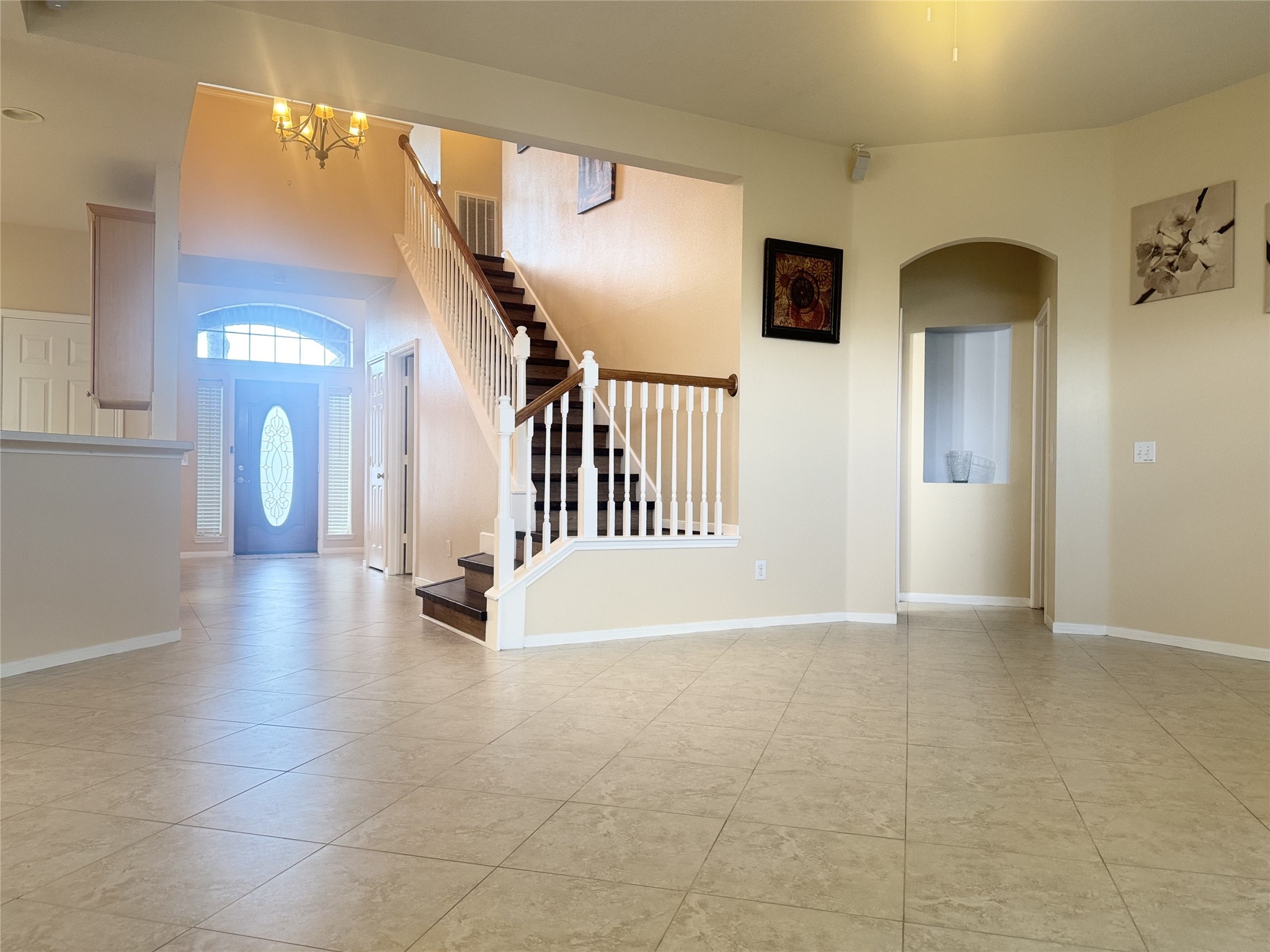 9810 Mossy Tree Lane Houston, TX 77064 - Photo 11 of 24 a view of a hallway with entryway wooden floor and front door