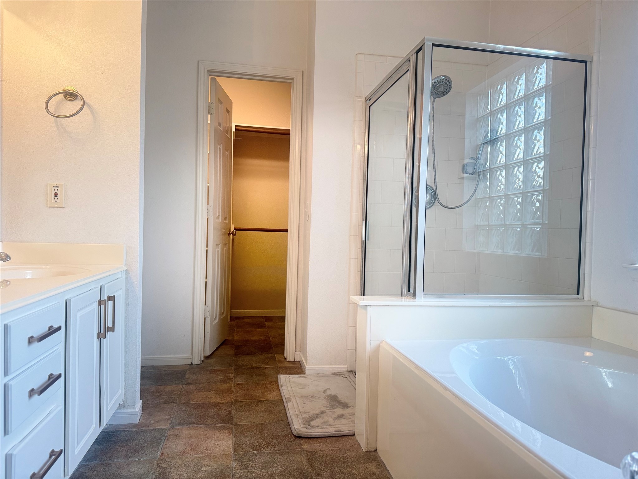 9810 Mossy Tree Lane Houston, TX 77064 - Photo 16 of 24 a bathroom with a bathtub and a shower