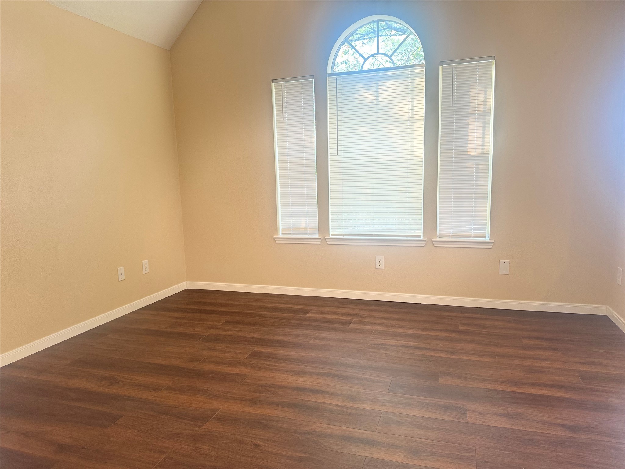 9810 Mossy Tree Lane Houston, TX 77064 - Photo 17 of 24 an empty room with wooden floor and window