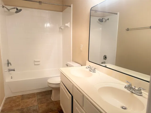a bathroom with a sink toilet tub and shower