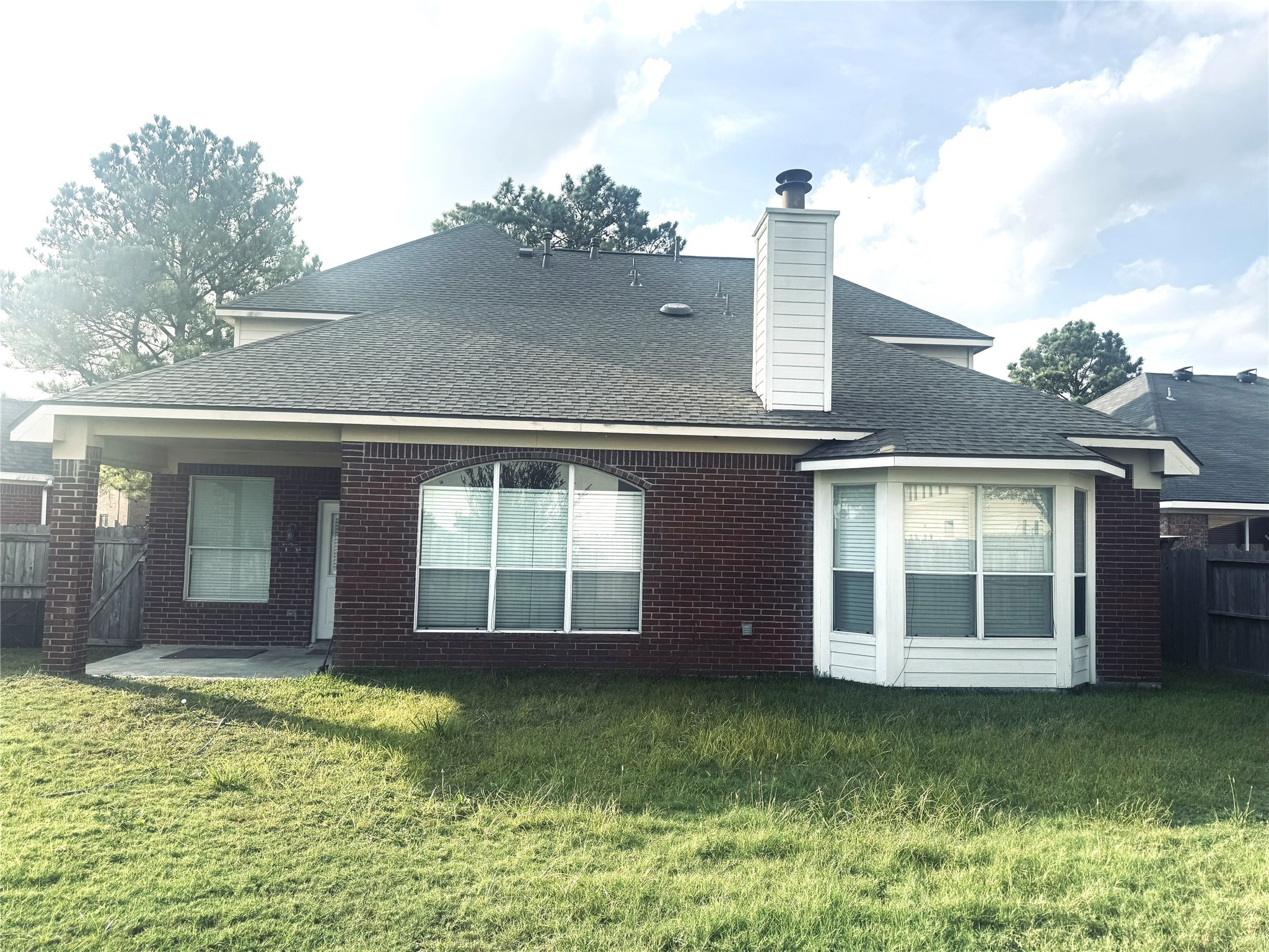 9810 Mossy Tree Lane Houston, TX 77064 - Photo 23 of 24 a front view of a house with a yard